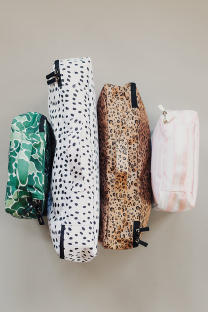 A combination of Brixley Bags packing cubes consisting of one (1) small camouflage (Scout) packing cube, one (1) large Dalmation print packing cube, one (1) medium cheetah print (Wild Thing) packing cube, and one (1) small pink striped (Valentine) packing cube